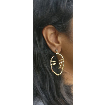 Gold hollow face earrings